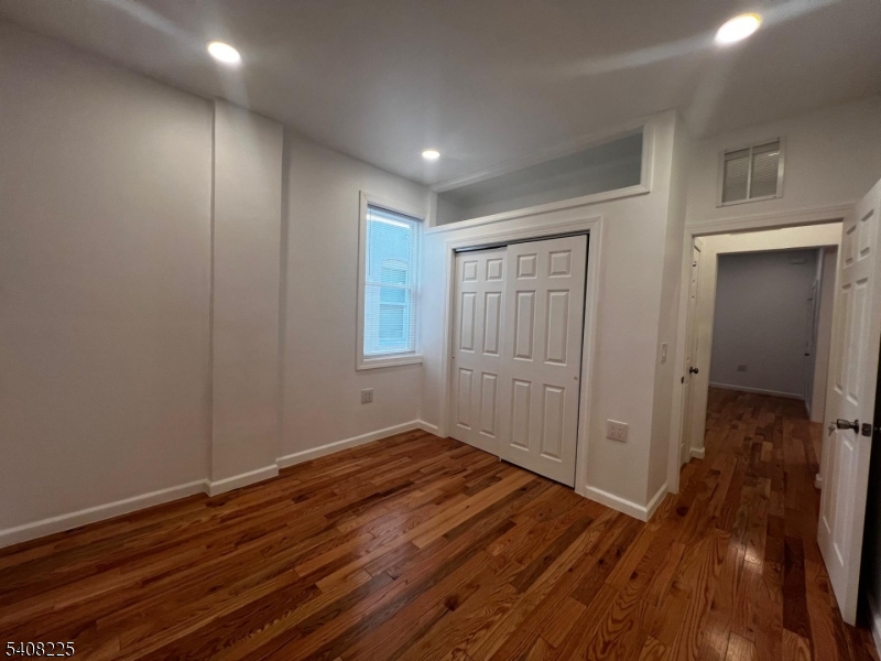 3 Montclair Avenue Paterson, NJ 07503 - Photo 13 of 17 a view of hallway with wooden floor