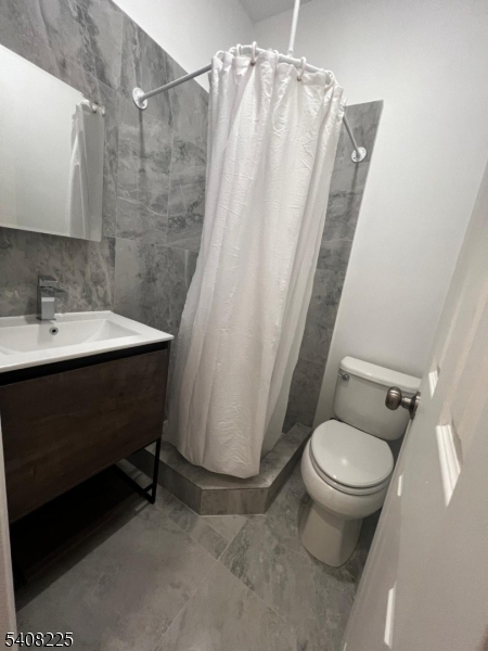 3 Montclair Avenue Paterson, NJ 07503 - Photo 17 of 17 a bathroom with a sink and a toilet