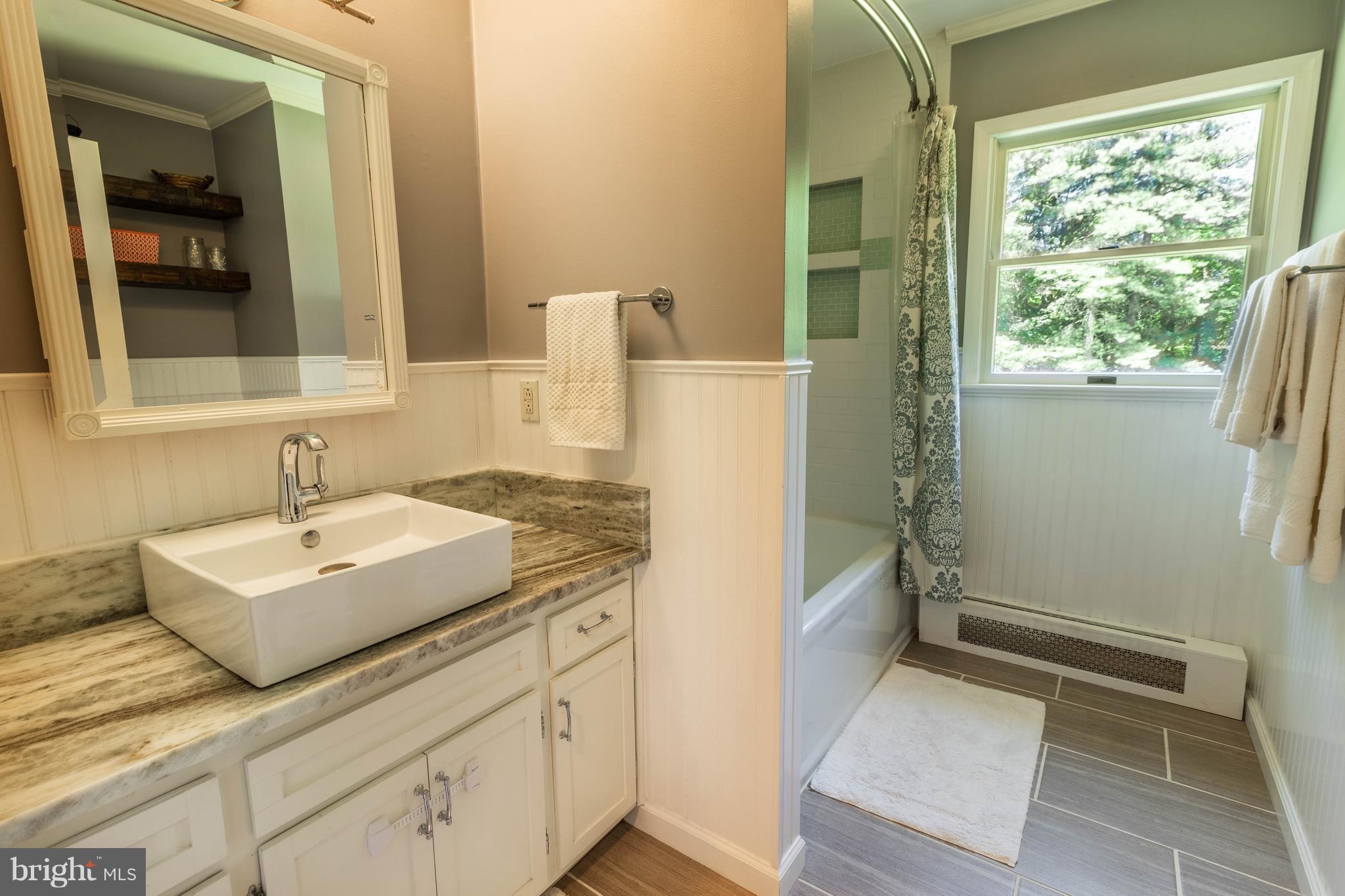 15400 Parrish Road Upperco, MD 21155 - Photo 14 of 30 a bathroom with a sink and a mirror