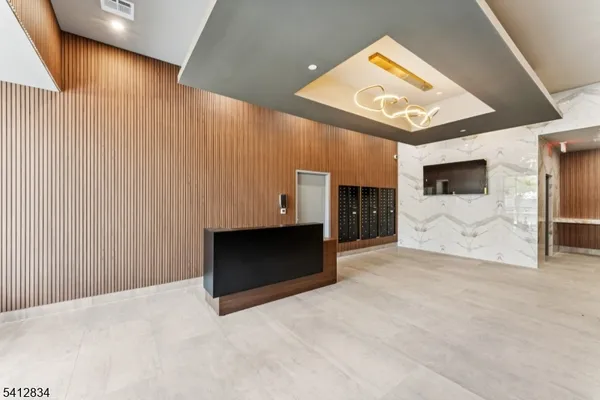 a view of a dining room with furniture and a potted plant