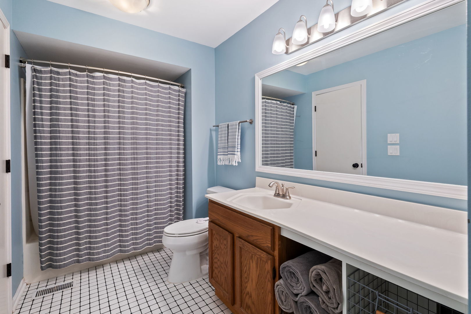 9702 Chelsea Place Mokena, IL 60448 - Photo 12 of 20 a bathroom with a sink a toilet and shower curtain