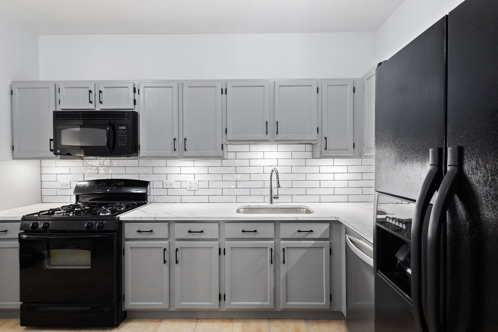 9702 Chelsea Place Mokena, IL 60448 - Photo 7 of 20 a kitchen with cabinets stainless steel appliances and a sink