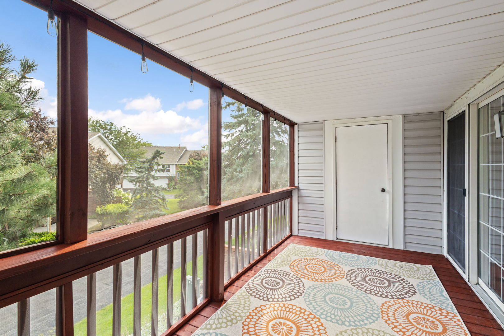 9702 Chelsea Place Mokena, IL 60448 - Photo 9 of 20 a view of a big room with wooden floor and windows