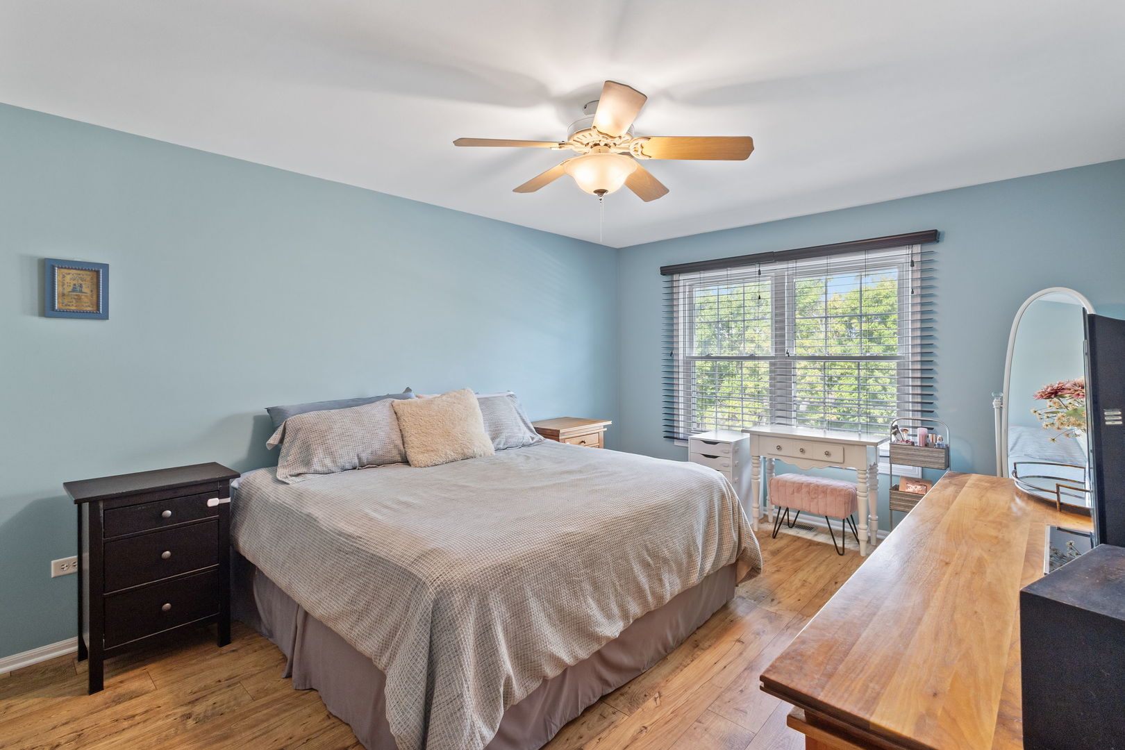 9702 Chelsea Place Mokena, IL 60448 - Photo 10 of 20 a bedroom with a bed and a chandelier