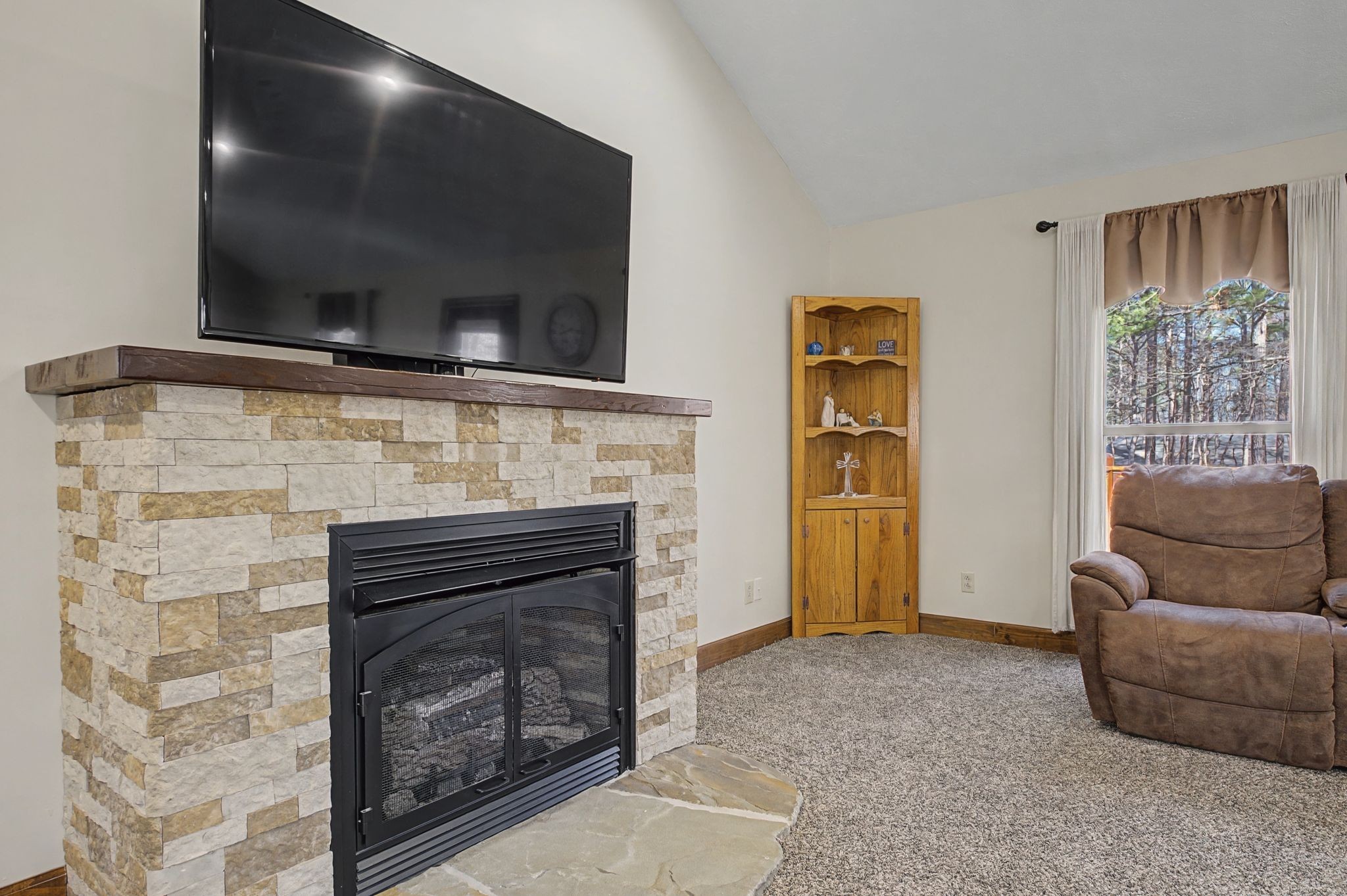 1231 Abiff Road Bon Aqua, TN 37025 - Photo 19 of 60 a living room with furniture and a fireplace