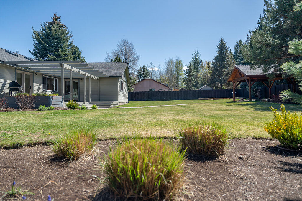 61275 Victory Loop Bend, OR 97702 - Photo 53 of 59 Private fenced back yard with mature trees and landscaping