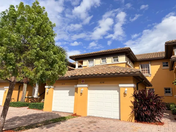 a view of a house with a tree