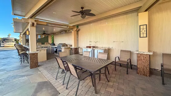 a kitchen with stainless steel appliances granite countertop a stove oven and a refrigerator