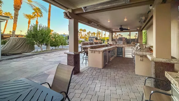 a view of a chairs and table in the patio