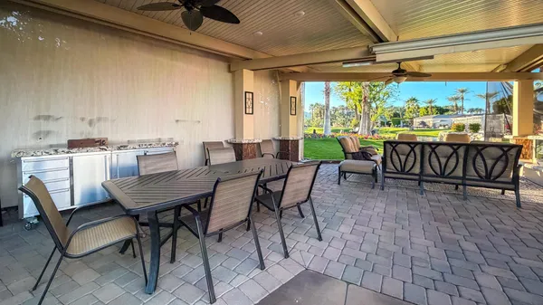 a view of a dining room with furniture window and outside view