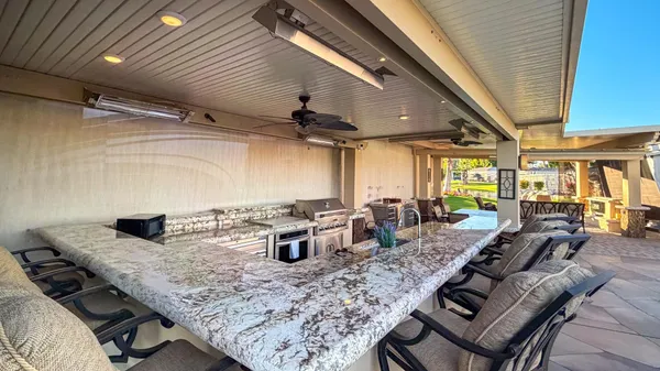 a view of a two chairs in front of a house