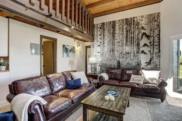 a living room with furniture and a bathtub