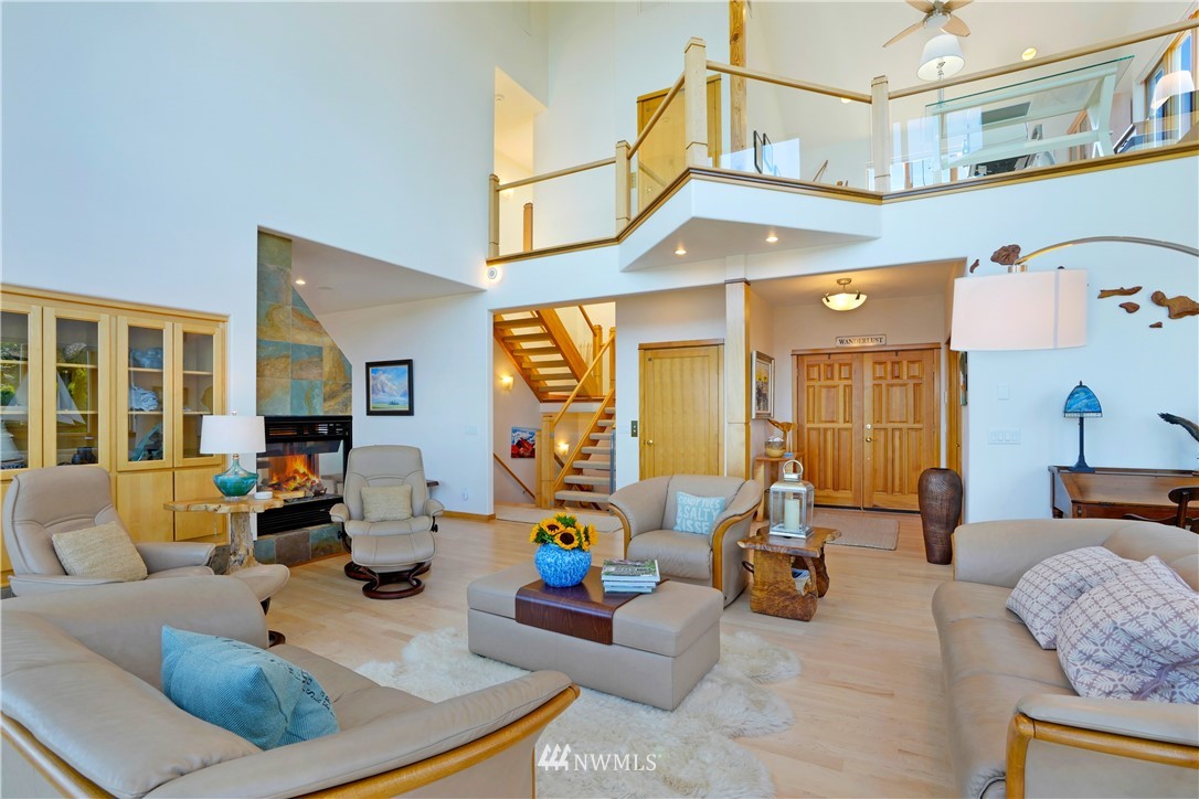 4844 G Loop Bow, WA 98232 - Photo 20 of 40 a living room with furniture and a chandelier