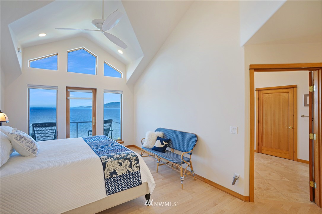 4844 G Loop Bow, WA 98232 - Photo 23 of 40 a bedroom with a bed and a lamp on dresser