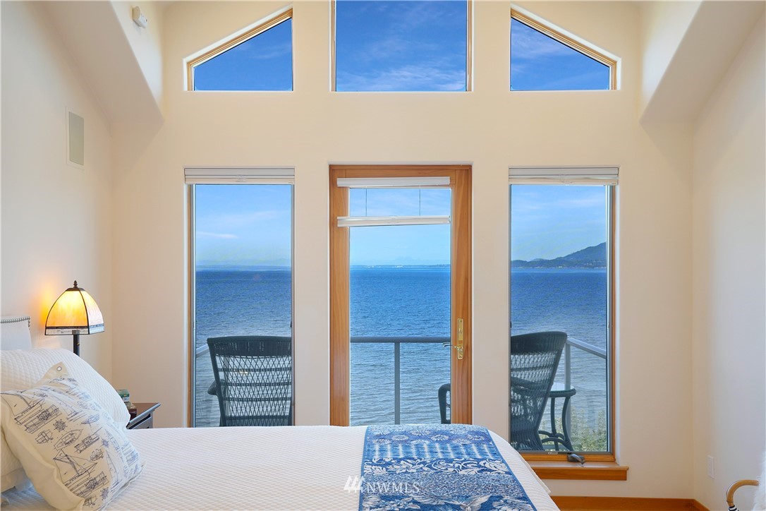 4844 G Loop Bow, WA 98232 - Photo 24 of 40 a bedroom with a bed and a lamp