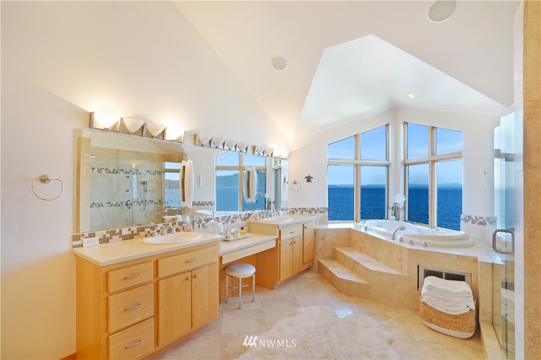 4844 G Loop Bow, WA 98232 - Photo 26 of 40 a spacious bathroom with a double vanity sink a mirror a bathtub and next to a window
