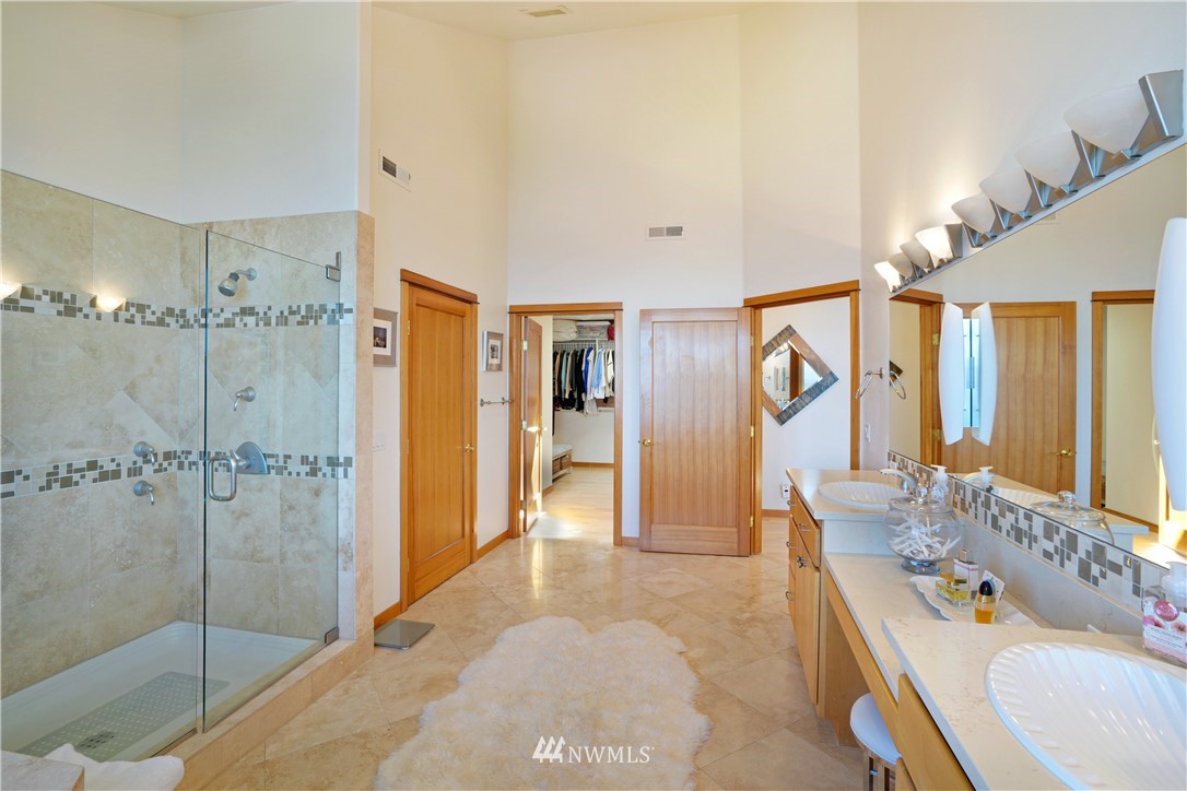 4844 G Loop Bow, WA 98232 - Photo 28 of 40 a bathroom with a tub sink shower and mirror