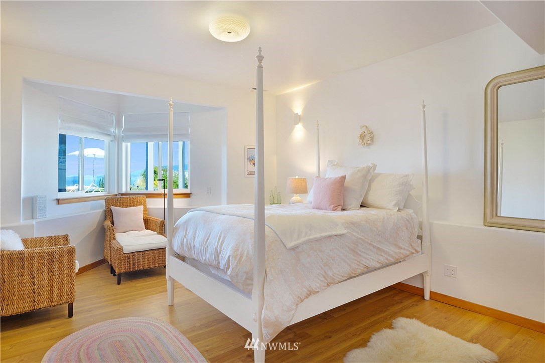 4844 G Loop Bow, WA 98232 - Photo 35 of 40 a bedroom with a bed and wooden floor