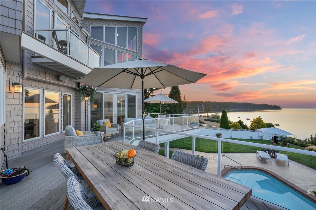 4844 G Loop Bow, WA 98232 - Photo 6 of 40 a view of a roof deck with table and chairs under an umbrella