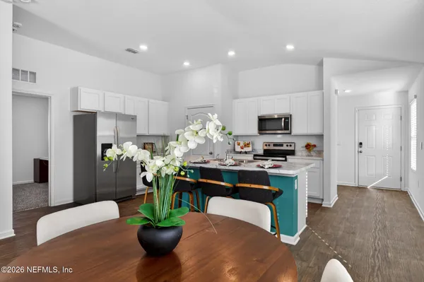 a living room with furniture a fireplace and a view