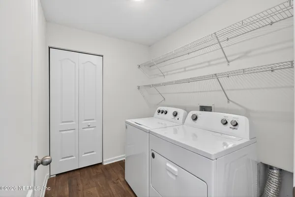 a utility room with washer and dryer