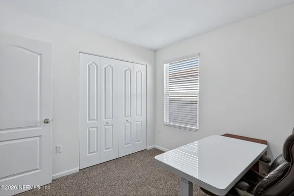 a view of an empty room and window