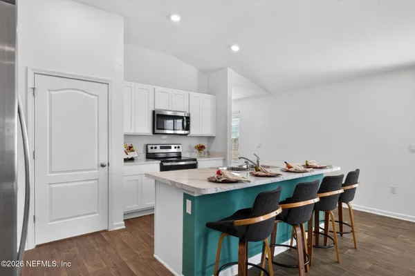 a table and chairs in a kitchen