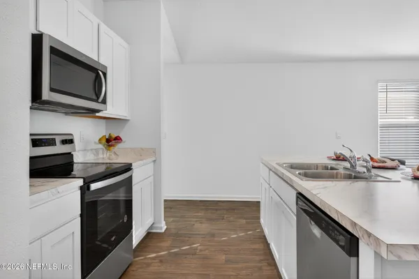 a view of a backyard of the house