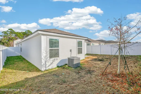 a view of backyard with garage
