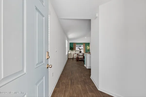 a view of a bedroom from a hallway