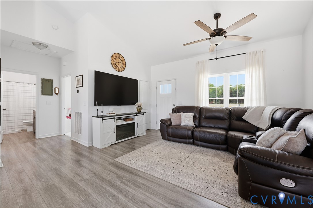 235 Stoney Point Road Cumberland, VA 23040 - Photo 23 of 35 a living room with furniture and a flat screen tv