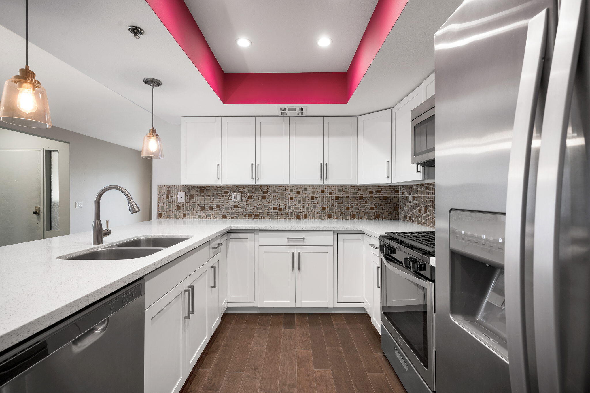 200 East Racquet Club Road, Unit 52 Palm Springs, CA 92262 - Photo 11 of 23 a kitchen with granite countertop a sink stainless steel appliances and cabinets