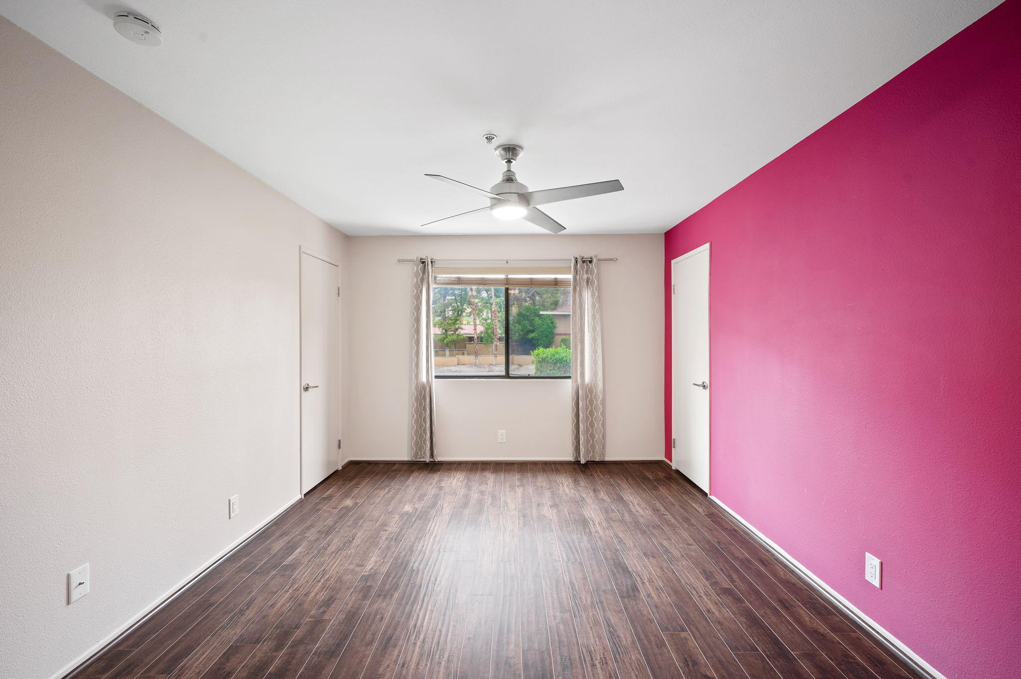 200 East Racquet Club Road, Unit 52 Palm Springs, CA 92262 - Photo 12 of 23 wooden floor in an empty room with a window