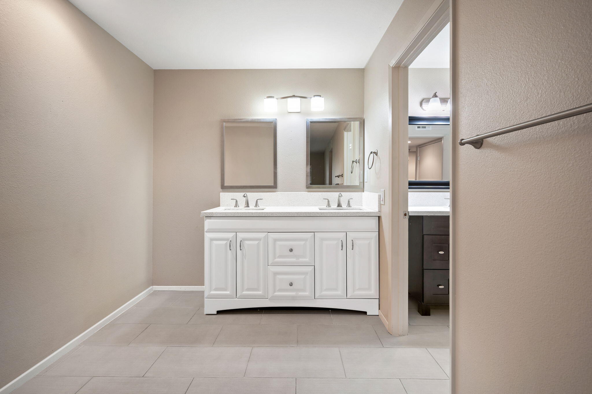 200 East Racquet Club Road, Unit 52 Palm Springs, CA 92262 - Photo 15 of 23 a bathroom with a double vanity sink and mirror