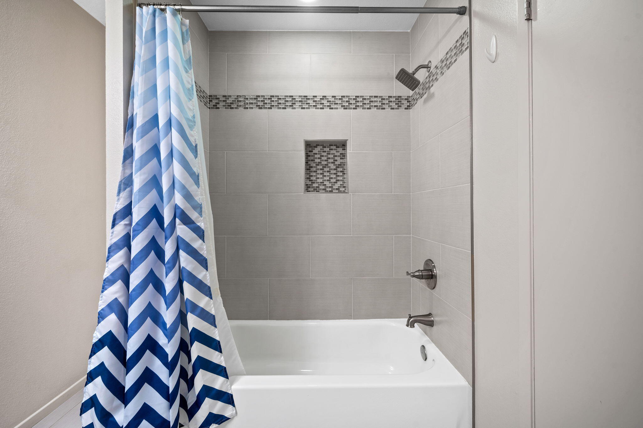 200 East Racquet Club Road, Unit 52 Palm Springs, CA 92262 - Photo 17 of 23 a bathroom with a bathtub and shower