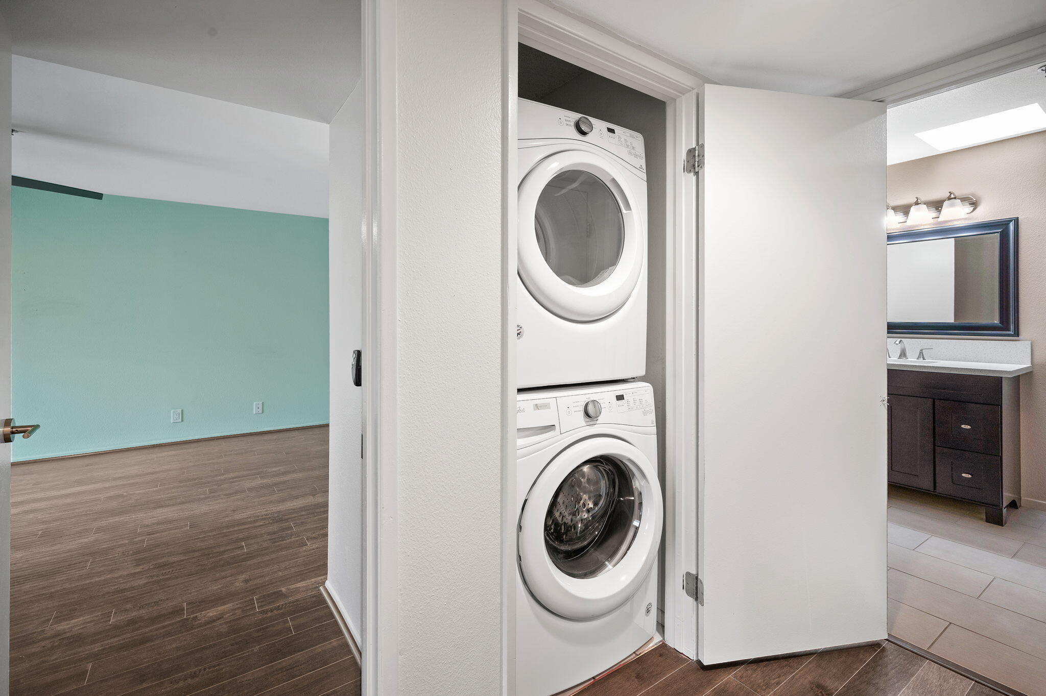 200 East Racquet Club Road, Unit 52 Palm Springs, CA 92262 - Photo 19 of 23 a view of a hallway with washer and dryer