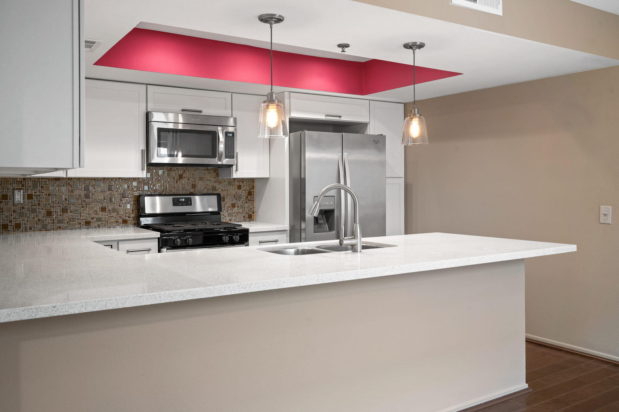 200 East Racquet Club Road, Unit 52 Palm Springs, CA 92262 - Photo 9 of 23 a kitchen with stainless steel appliances kitchen island a counter space and cabinets