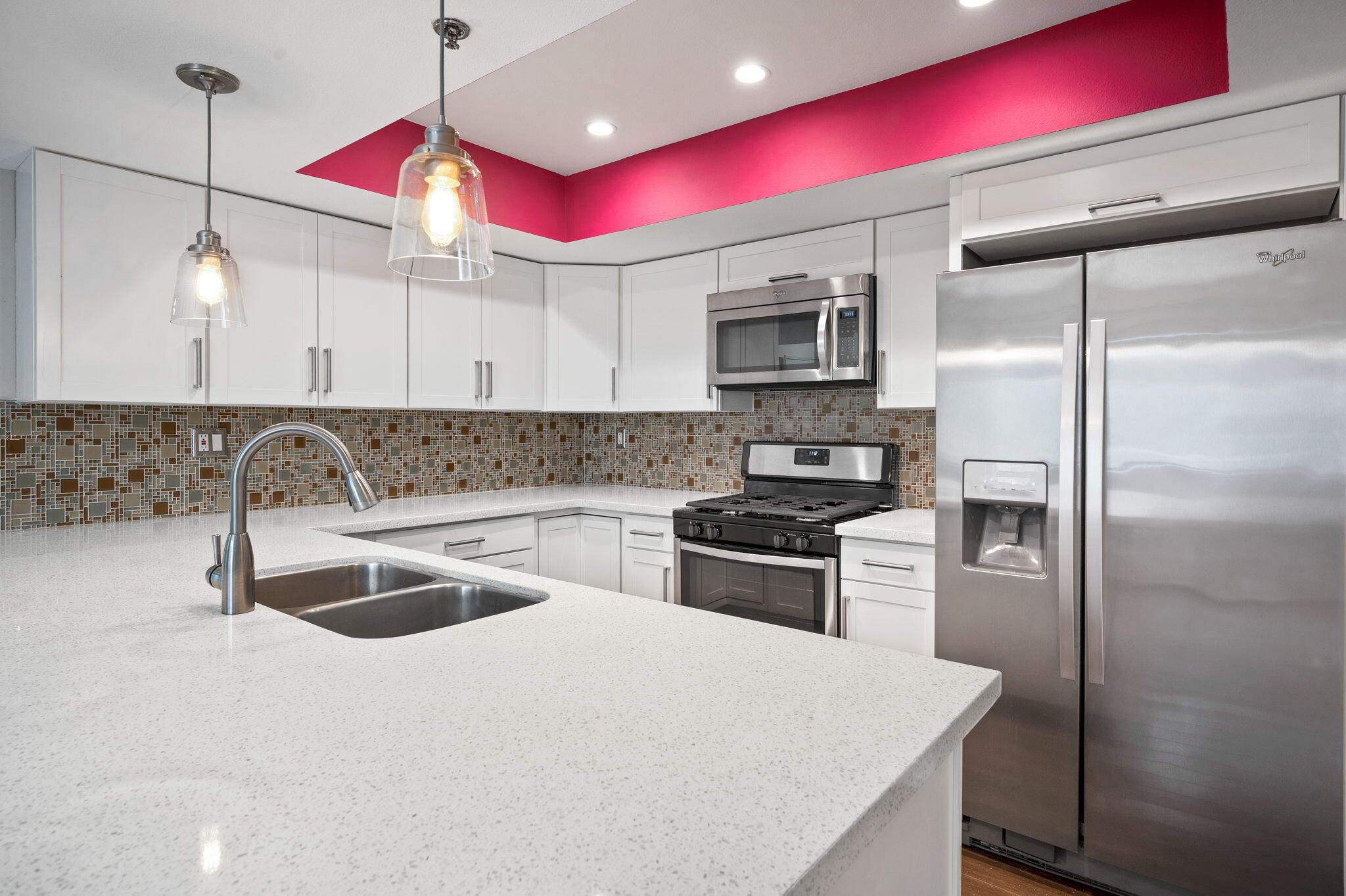 200 East Racquet Club Road, Unit 52 Palm Springs, CA 92262 - Photo 10 of 23 a kitchen with stainless steel appliances granite countertop a sink refrigerator and stove