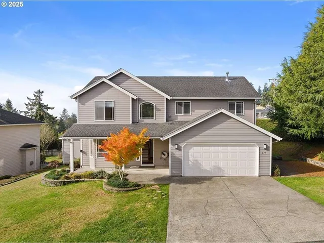 a front view of a house with yard