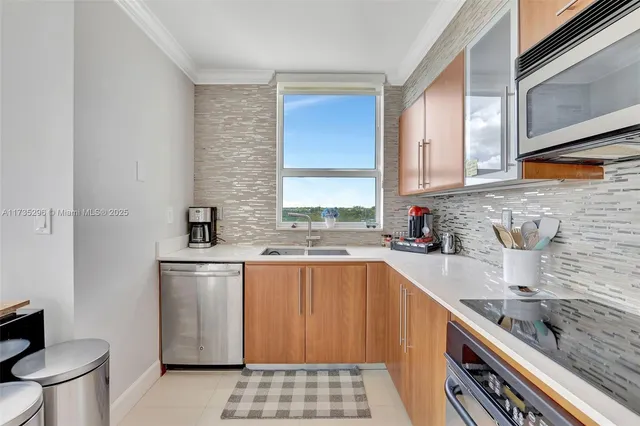 a kitchen with a sink stove and cabinets