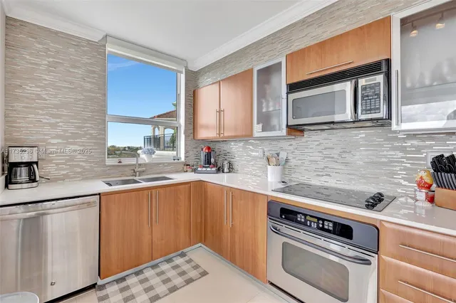 a kitchen with a sink stove and cabinets