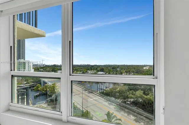 a view of a glass door and a window