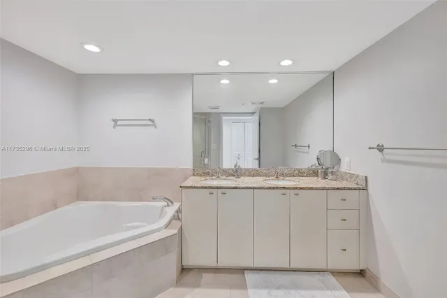 a bathroom with a bath tub and a shower