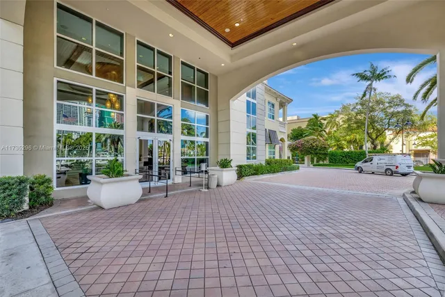 a view of a swimming pool with outdoor seating and plants