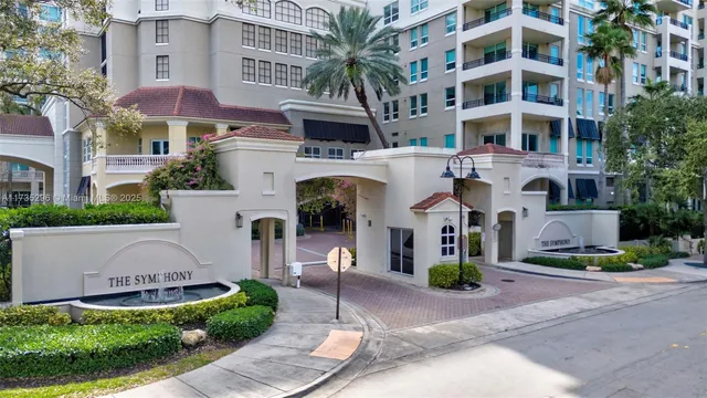 a couple of cars parked in front of a building