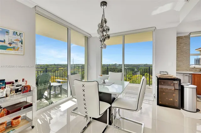 a very nice looking room with a large window and furniture