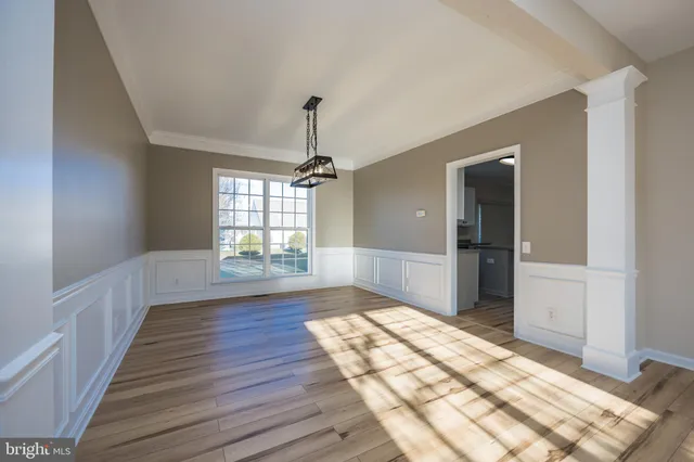 a kitchen with appliances cabinets and a window