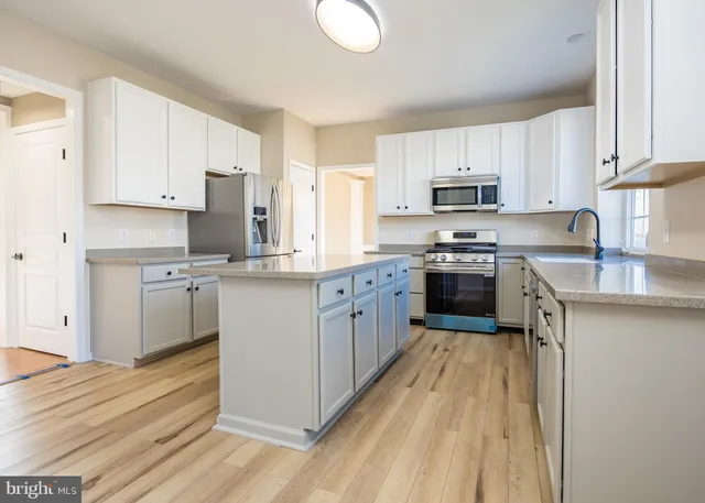 a white toilet sitting next to a shower