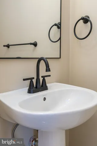 a view of empty room with wooden floor and window