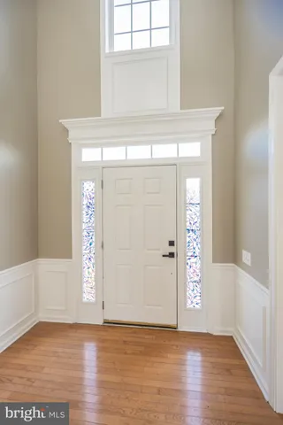 wooden floor in a room next to a window